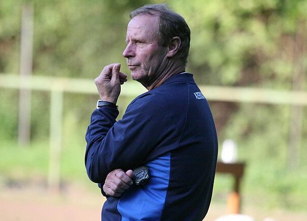 Berti Vogts watching thoughtfully with fingers against chin
