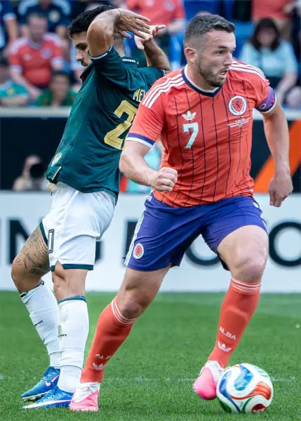 John McGinn, Scotland v Bolivia. Turning away from a defender.