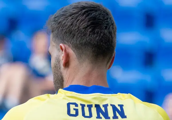 Angus Gunn Scotland v Bolivia. Head & shoulders from behind with name on jersey.