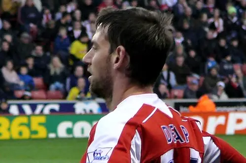 Rory Delap of Stoke City standing with the ball at the touchline.