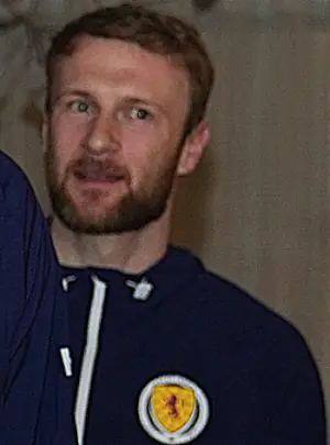 Scott Bain in Scotland gear in line to meet out of shot John Swinney.